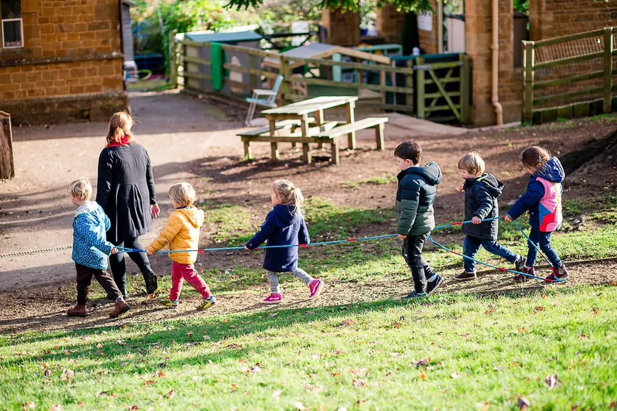 Children walking across the school field